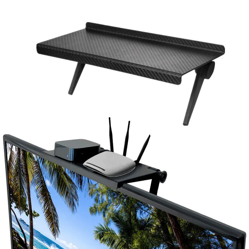Tablette de rangement noire à appuis réglables pour écran.